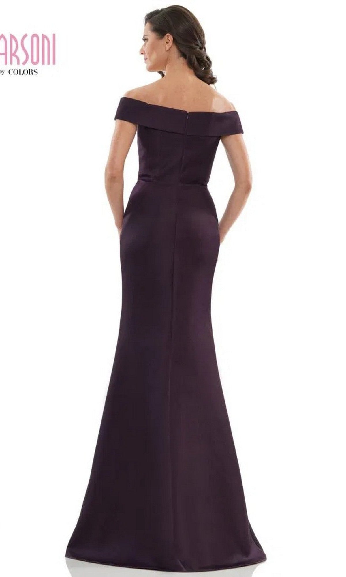 A woman is seen from the back wearing the Marsoni MV1003, a long formal off-the-shoulder satin evening gown in dark purple, fitted and floor-length, set against a plain white background.